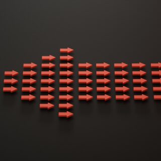 Röd pil mot svart bakgrund